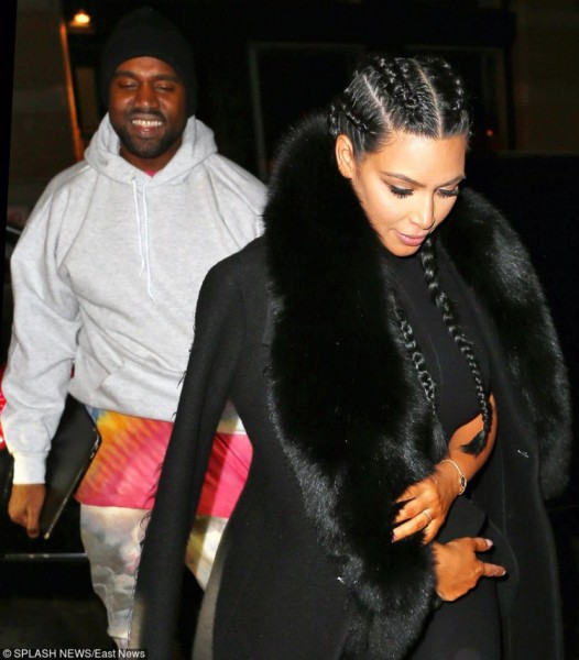 Kim Kardashian hides behind Kanye West when out and about in New York Pictured: Kim Kardashian,Kanye West